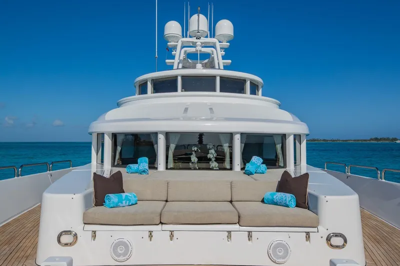Slide: The Image of Luxurious 1988 Van Mill Custom yacht with plush seating, ocean backdrop, and clear blue skies. - 18