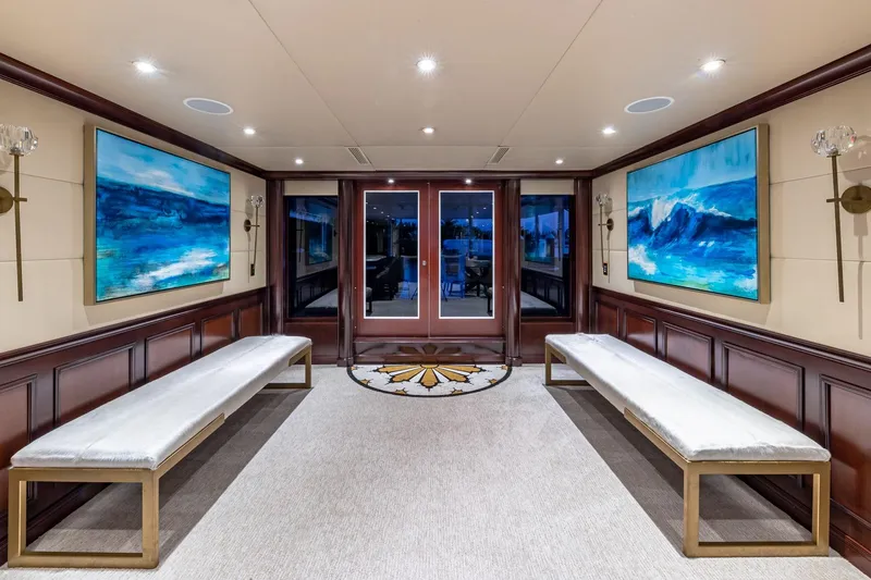 Slide: The Image of Luxurious 1988 Van Mill Custom yacht interior with elegant benches and ocean-themed artwork. - 27