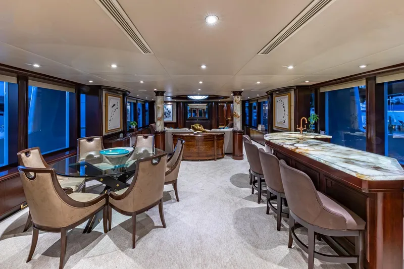 Slide: The Image of Luxurious 1988 Van Mill Custom yacht interior with elegant dining and bar area. - 28