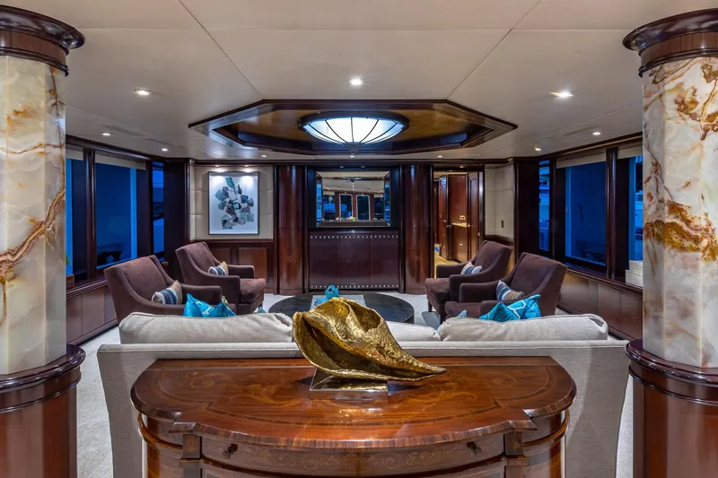Slide: The Image of Luxurious yacht interior with elegant seating, marble columns, and artistic decor, Van Mill Custom 1988. - 33