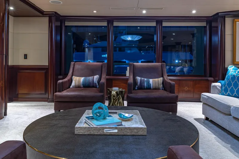 Slide: The Image of Luxurious yacht interior with elegant seating, modern decor, and ambient lighting, Van Mill Custom 1988. - 36