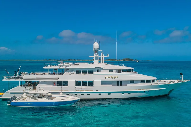 Slide: The Image of Luxurious 1988 Van Mill Custom yacht "Star Ship" anchored in clear blue ocean waters. - 4