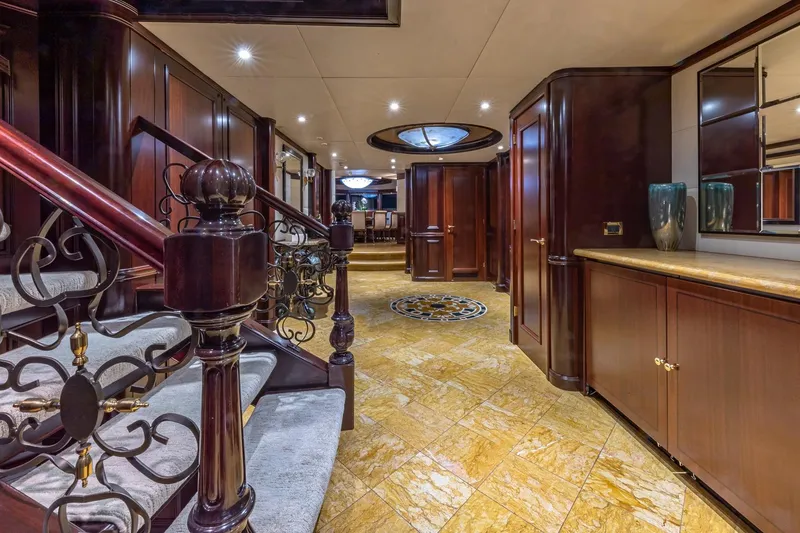 Slide: The Image of Luxurious interior of 1988 Van Mill Custom yacht with elegant wood finishes and ornate staircase. - 42