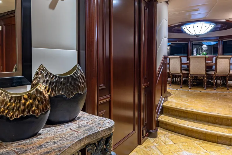 Slide: The Image of Luxurious 1988 Van Mill Custom yacht interior with elegant dining area and decorative vases. - 44