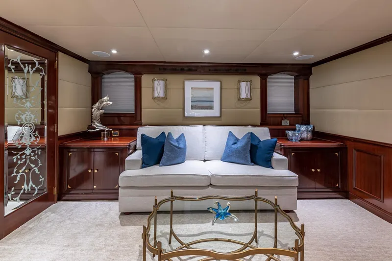 Slide: The Image of Luxurious 1988 Van Mill yacht interior with elegant sofa, blue cushions, and decorative accents. - 58