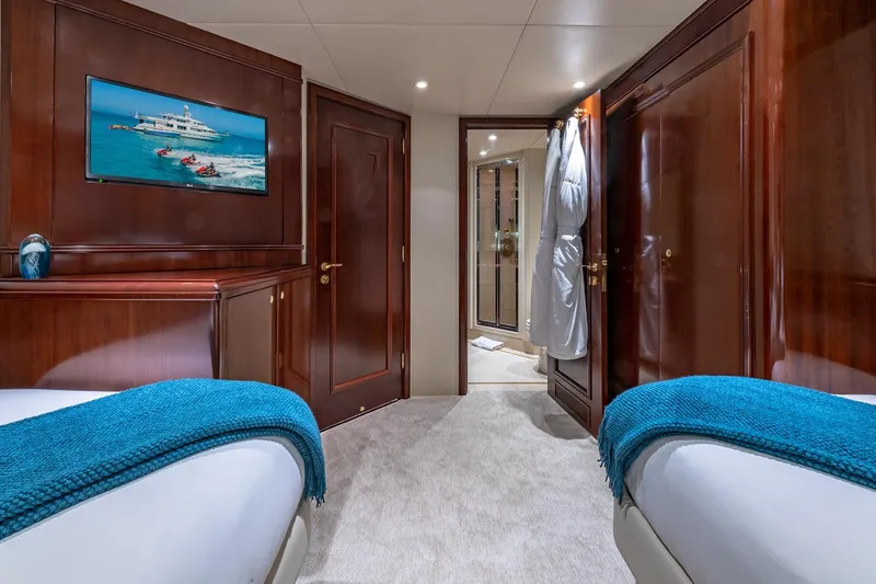 Slide: The Image of Luxurious 1988 Van Mill Custom yacht cabin with twin beds, elegant wood paneling, and modern decor. - 64