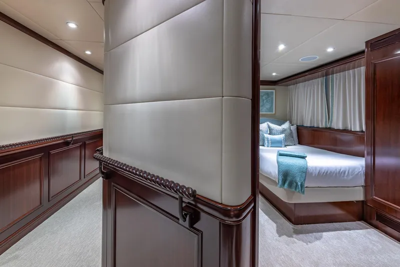 Slide: The Image of Luxurious 1988 Van Mill Custom yacht interior with elegant wood paneling and cozy bedroom. - 65