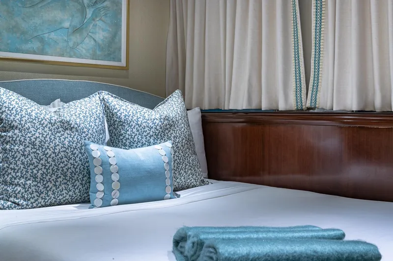 Slide: The Image of Luxurious 1988 Van Mill Custom yacht bedroom with elegant blue and white decor. - 68