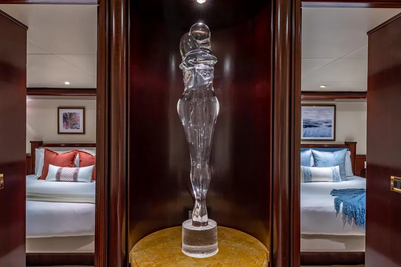 Slide: The Image of Luxurious yacht interior with elegant glass sculpture, flanked by two cozy bedrooms. Van Mill 1988. - 72