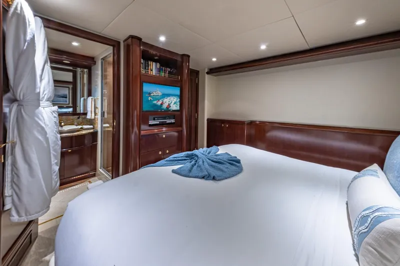 Slide: The Image of Luxurious 1988 Van Mill Custom yacht bedroom with elegant wood paneling and modern amenities. - 76