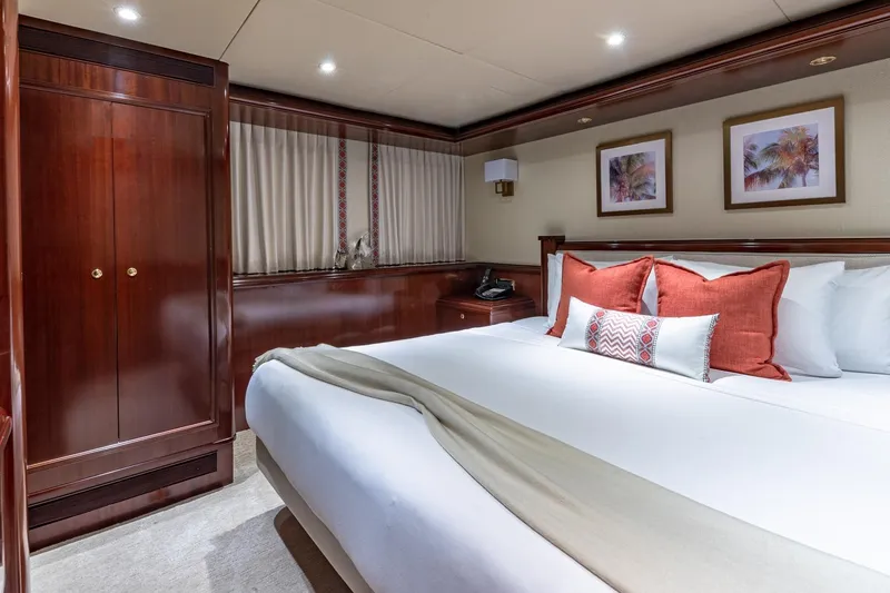 Slide: The Image of Luxurious 1988 Van Mill Custom yacht bedroom with elegant wood finishes and plush bedding. - 78