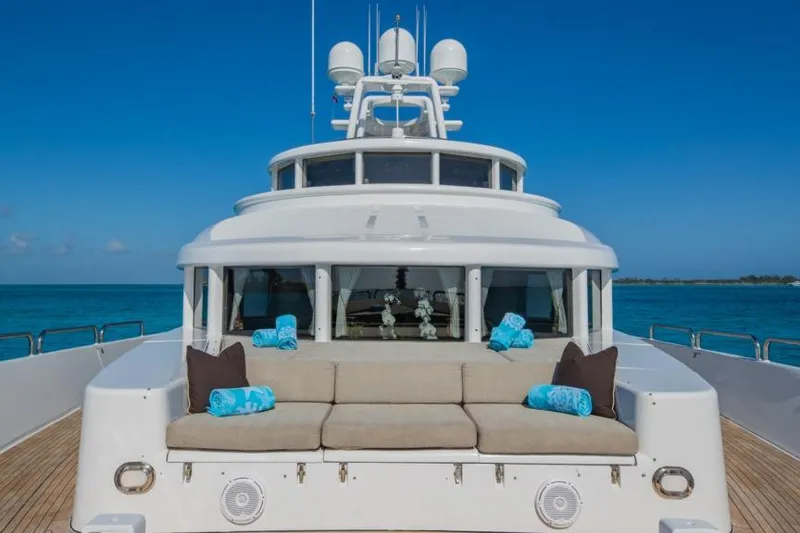 Slide: The Image of Luxury 1988 Van Mill Custom yacht deck with seating, ocean view, and clear blue sky. - 84