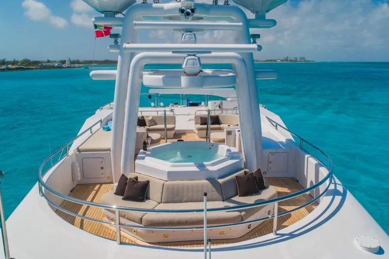 Slide: The Image of Luxurious 1988 Van Mill Custom yacht with jacuzzi, surrounded by turquoise ocean waters. - 85