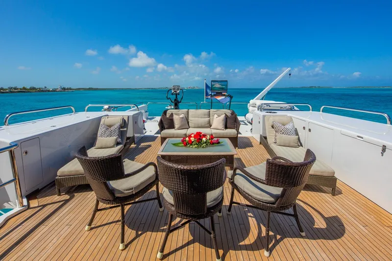 Slide: The Image of Luxury yacht deck with wicker seating, ocean view; Van Mill Custom, 1988 model. - 92