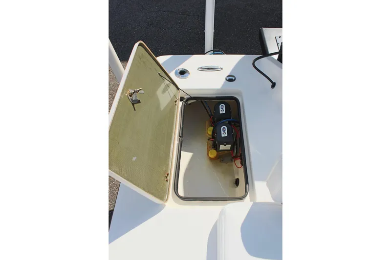 Slide: The Image of Open hatch on 2017 Sterling TR7 boat showing battery compartment. - 15