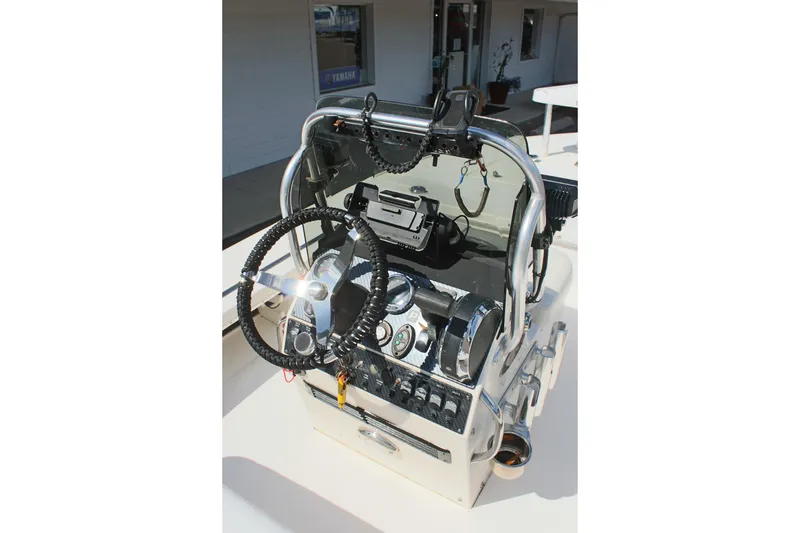 Slide: The Image of Sterling TR7 2017 boat console with steering wheel and control panel. - 17