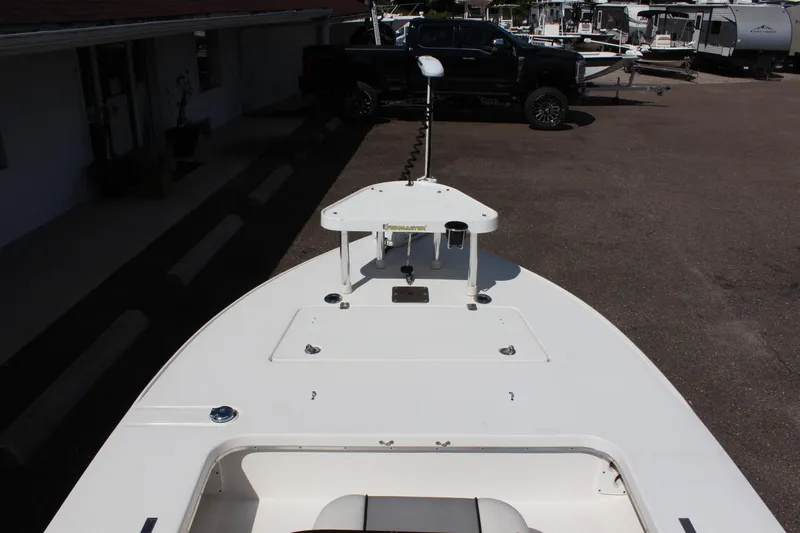 Slide: The Image of 2017 Sterling TR7 boat deck with trolling motor in parking lot. - 18