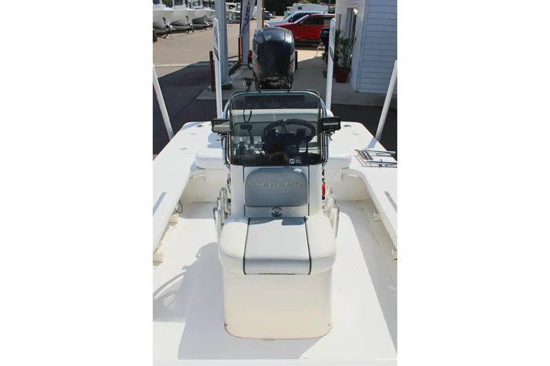 Slide: The Image of 2017 Sterling TR7 boat console with steering wheel and seating. - 23