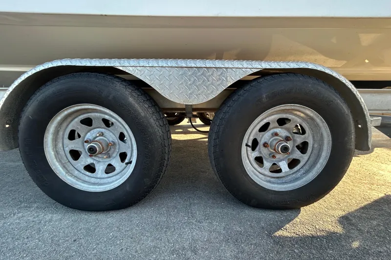 Slide: The Image of 2019 Robalo R242 Explorer boat interior with seating and steering console. - 14