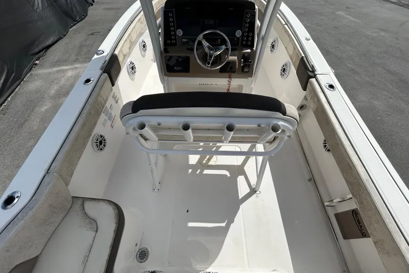 Slide: The Image of 2019 Robalo R242 Explorer boat cockpit with steering wheel and seating. - 16