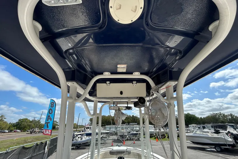 Slide: The Image of 2019 Robalo R242 Explorer boat interior with overhead view, showcasing structure and equipment. - 21