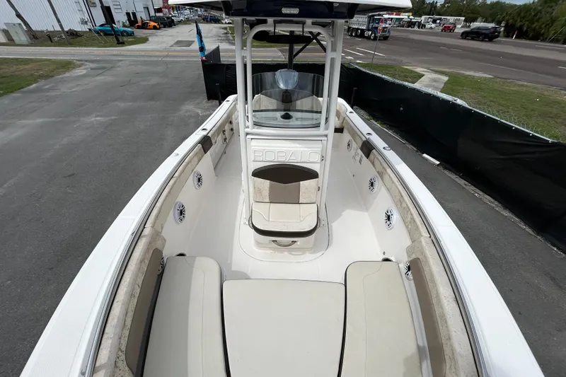 Slide: The Image of 2019 Robalo R242 Explorer boat interior with seating and console view. - 28