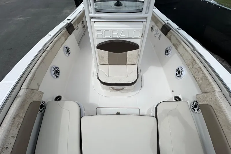 Slide: The Image of 2019 Robalo R242 Explorer boat interior with seating and speakers. - 29
