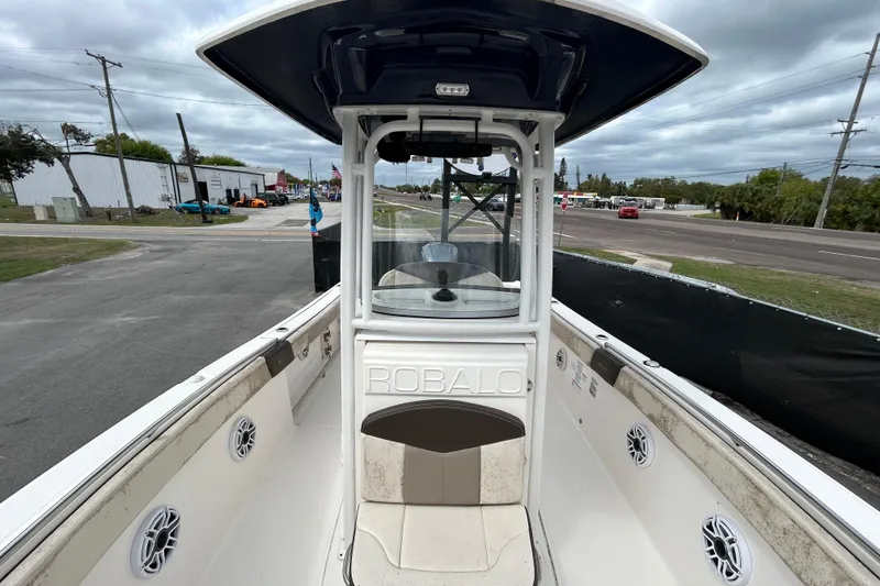 Slide: The Image of 2019 Robalo R242 Explorer boat interior with center console and seating. - 30