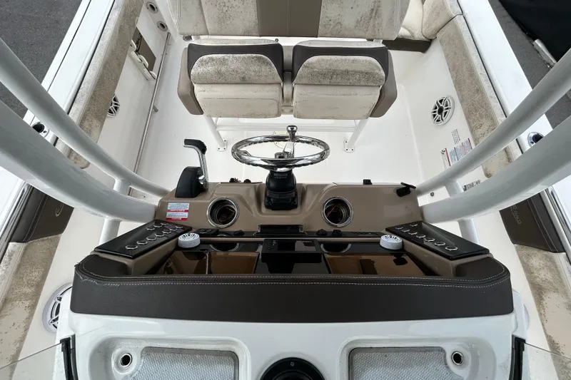 Slide: The Image of 2019 Robalo R242 Explorer boat cockpit with steering wheel and controls. - 31