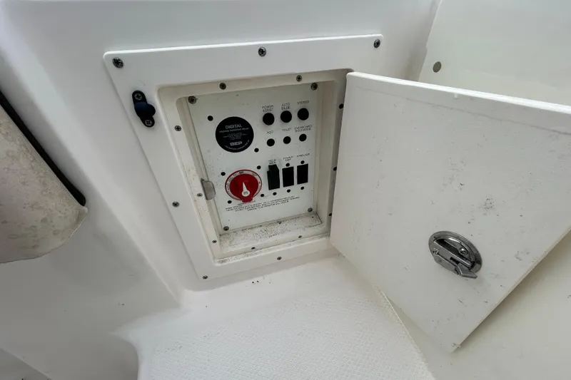 Slide: The Image of Control panel inside a 2019 Robalo R242 Explorer boat compartment. - 38