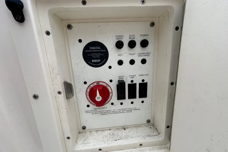 Slide: The Image of Control panel of a 2019 Robalo R242 Explorer boat with various switches and labels. - 39