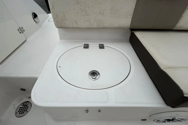 Slide: The Image of 2019 Robalo R242 Explorer boat seating area with storage compartment. - 41