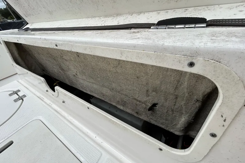 Slide: The Image of Open storage compartment on a 2019 Robalo R242 Explorer boat. - 51