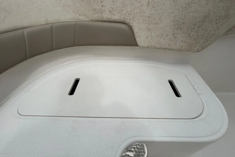 Slide: The Image of 2019 Robalo R242 Explorer boat interior storage compartment with textured lid. - 53