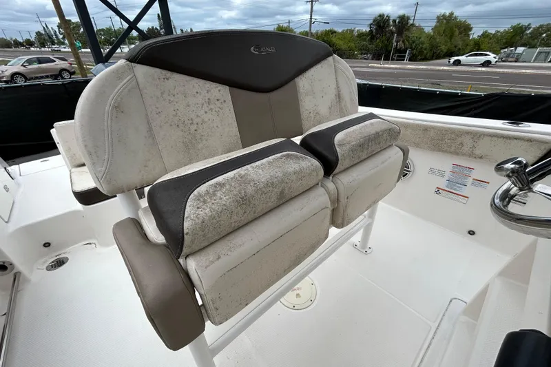 Slide: The Image of 2019 Robalo R242 Explorer boat seat with visible wear and mold. - 56