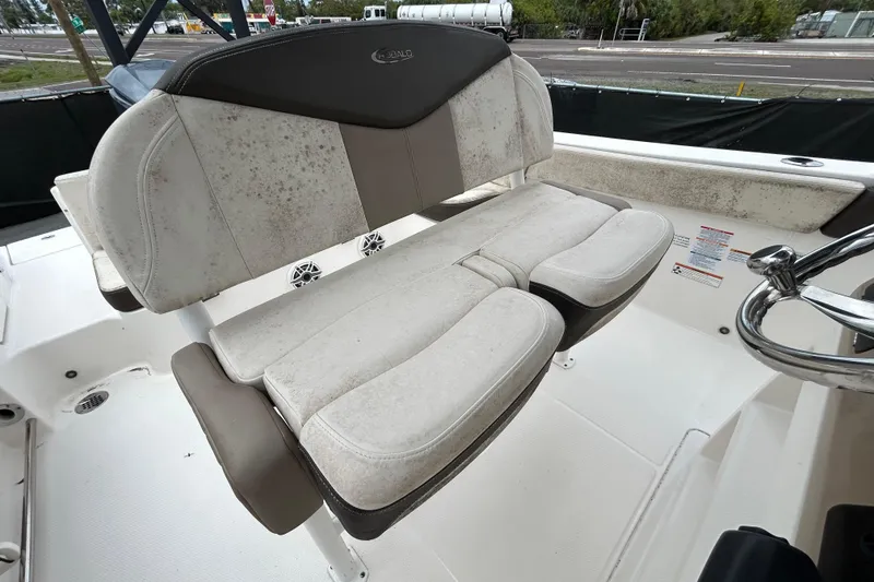 Slide: The Image of 2019 Robalo R242 Explorer boat seat with visible wear and mold. - 57