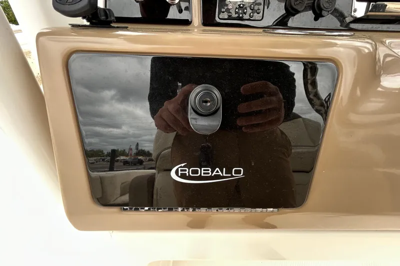 Slide: The Image of Control panel of 2019 Robalo R242 Explorer boat with reflection. - 58