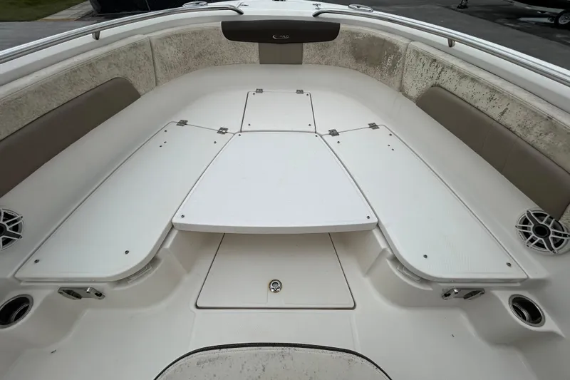 Slide: The Image of 2019 Robalo R242 Explorer boat interior with seating and storage compartments. - 65