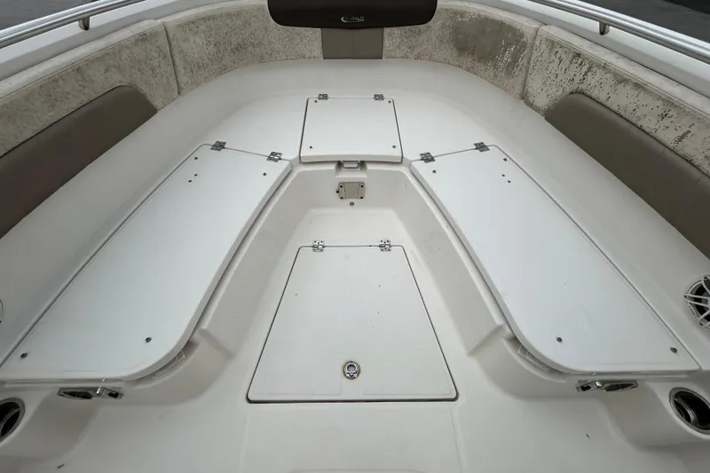 Slide: The Image of 2019 Robalo R242 Explorer boat interior with storage compartments and seating. - 66