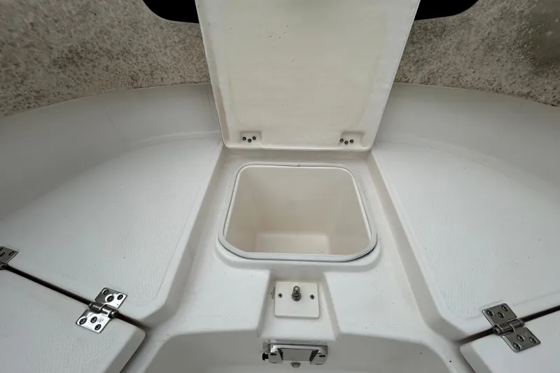 Slide: The Image of 2019 Robalo R242 Explorer boat storage compartment with open hatch. - 71