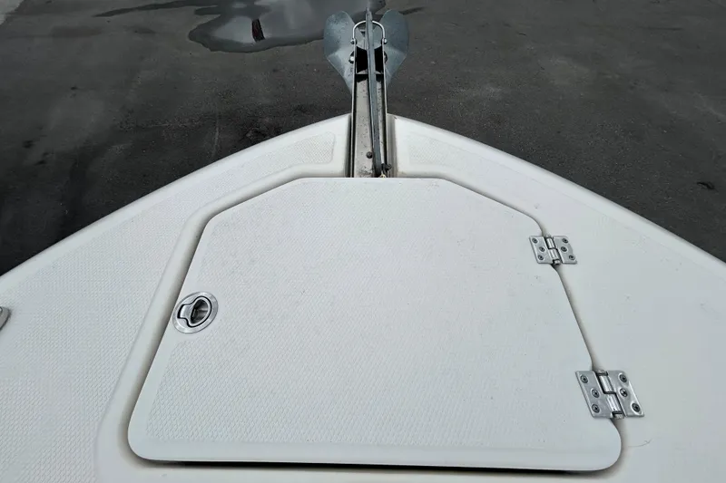 Slide: The Image of Bow of 2019 Robalo R242 Explorer boat with anchor hatch. - 73