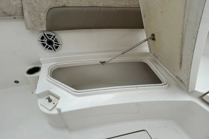 Slide: The Image of Open storage compartment on 2019 Robalo R242 Explorer boat deck. - 77