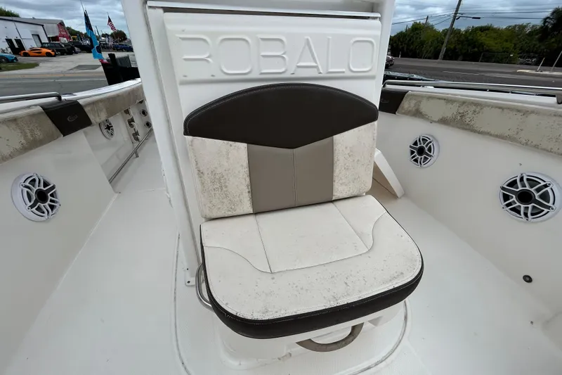 Slide: The Image of Robalo R242 Explorer 2019 boat seat with speakers, showcasing interior design. - 82