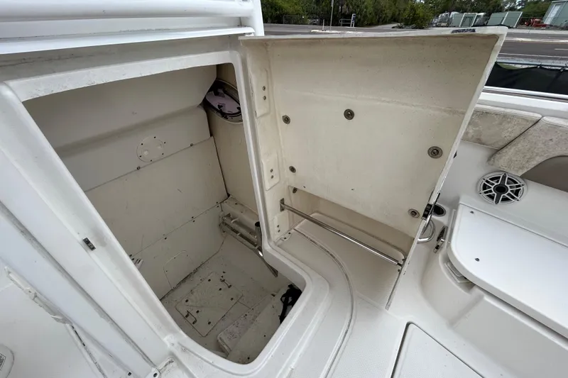 Slide: The Image of Open storage compartment on 2019 Robalo R242 Explorer boat deck. - 83