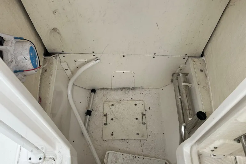 Slide: The Image of 2019 Robalo R242 Explorer interior compartment with storage and equipment. - 85