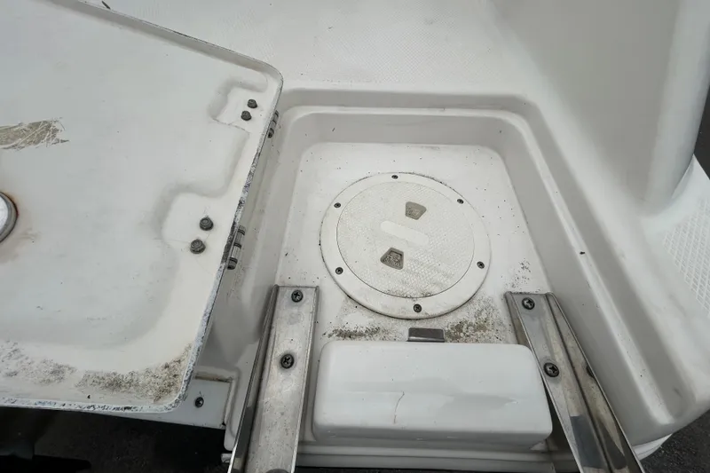 Slide: The Image of 2019 Robalo R242 Explorer boat deck with storage compartment and hatch. - 87