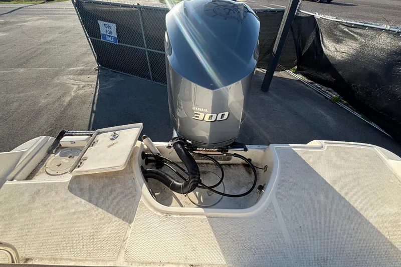 Slide: The Image of 2019 Robalo R242 Explorer boat on display under clear blue sky. - 9