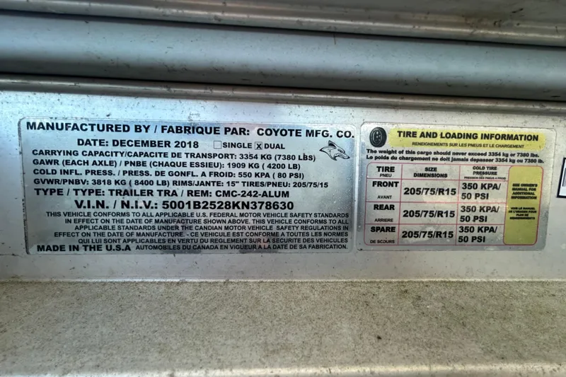 Slide: The Image of 2019 Robalo R242 Explorer trailer label with tire and loading information. - 93