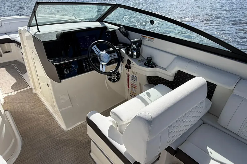 Slide: The Image of 2020 Sea Ray SDX 290 Outboard boat interior with modern helm and seating. - 15