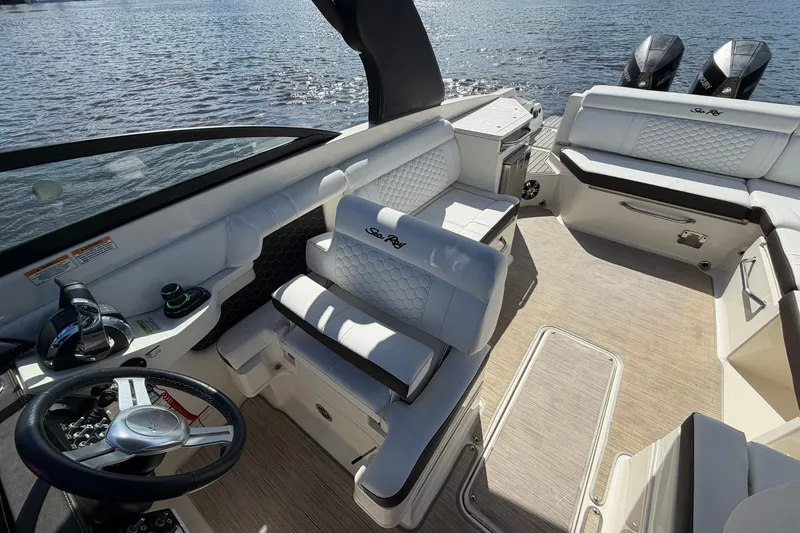 Slide: The Image of 2020 Sea Ray SDX 290 Outboard boat interior with luxurious seating and dual outboard engines. - 24